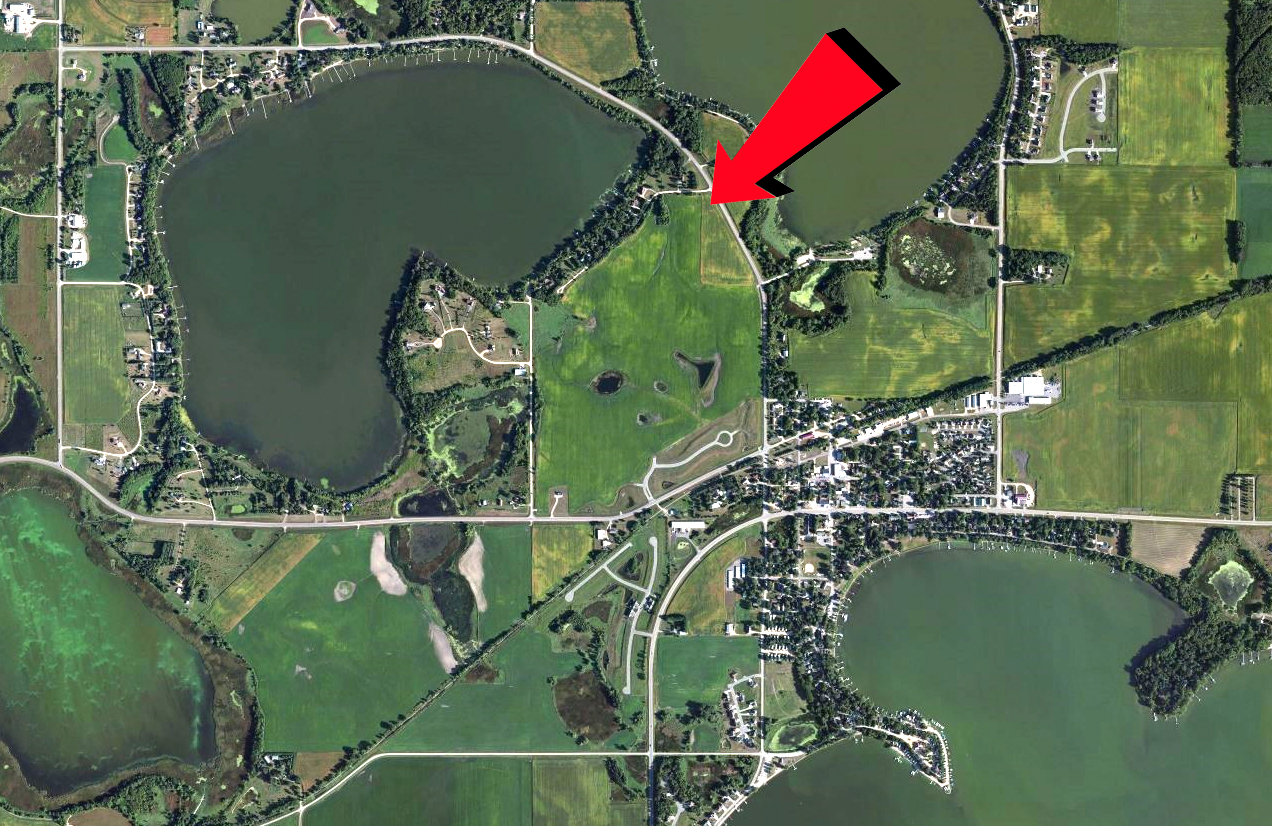 A satellite view shows why we say this house is nestled among three lakes.